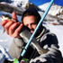 files/Angler_Holding_a_Fish_with_a_Wasatch_Tenkara_Rod_in_Focus.png